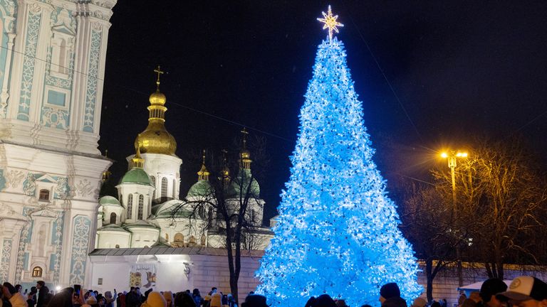 People gather around Ukraine's main Christmas tree after its lights were switched on, amid Russia's attack on Ukraine, in Sophia Square in Kyiv, Ukraine December 6, 2024. REUTERS/Thomas Peter

