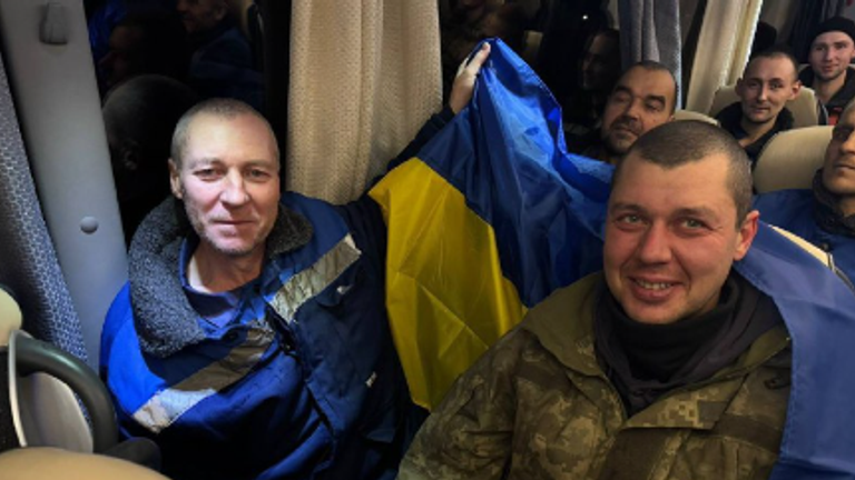 Some of the freed prisoners carried Ukrainian flags. Pic: Ukrainian president's office/Telegram