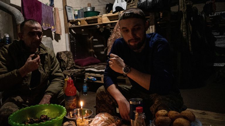 Service members of the 33rd Separate Mechanized Brigade of the Ukrainian Armed Forces eat meals during a Christmas Eve dinner at a position near a front line, amid Russia's attack on Ukraine, in Dnipropetrovsk region, Ukraine December 24, 2024. Volodymyr Petrov/Press Service of the 33rd Separate Mechanized Brigade of the Ukrainian Armed Forces/Handout via REUTERS ATTENTION EDITORS - THIS IMAGE HAS BEEN SUPPLIED BY A THIRD PARTY. DO NOT OBSCURE LOGO.

