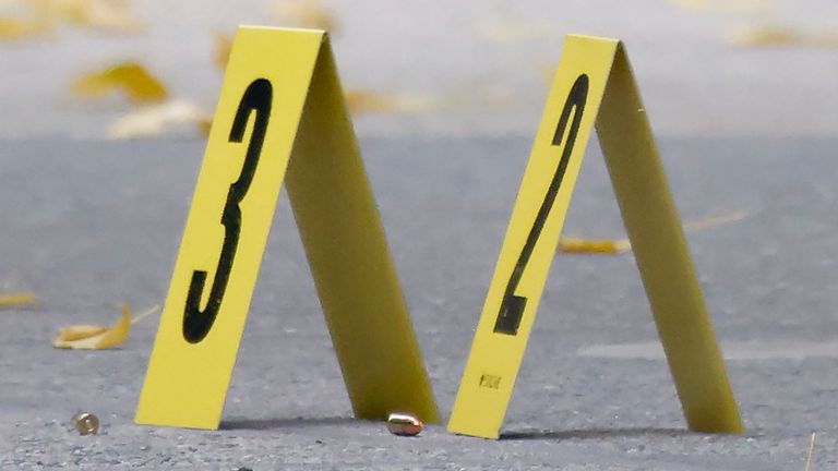 Bullets lie on the sidewalk at the scene outside the Hilton Hotel in midtown Manhattan where Brian Thompson, the CEO of UnitedHealthcare, was fatally shot.
Pic: AP