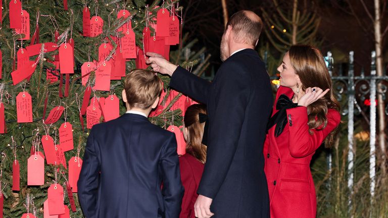 William and Kate by the Kindness tree with their children. Pic: Reuters

