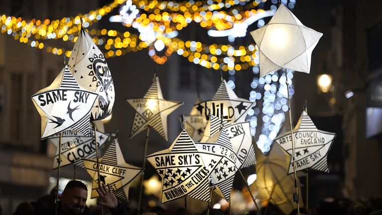 Participants carry lanterns during the 'Burning the Clocks' parade of lanterns on Brighton beach in East Sussex as part of the Winter Solstice celebrations. Picture date: Wednesday December 21, 2022.