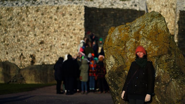 People gather at Newgrange, Co. Meath, on the morning of the winter solstice, which is marked by pagan celebrations. Picture date: Wednesday December 21, 2022. Newgrange is a prehistoric monument in County Meath, Ireland. It is thought the Neolithics built Newgrange over 5,000 years ago so that the sun shone on the ashes of their dead in the tomb, representing a sign of rebirth.