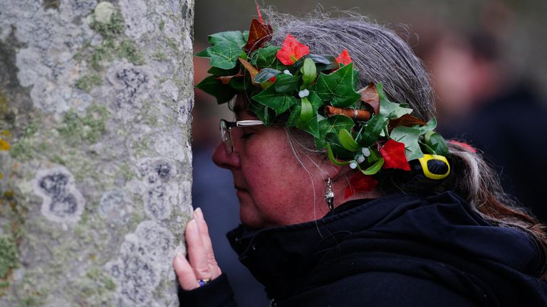 People take part in the winter solstice celebrations during sunrise at the Stonehenge prehistoric monument on Salisbury Plain in Wiltshire. Picture date: Thursday December 22, 2022.