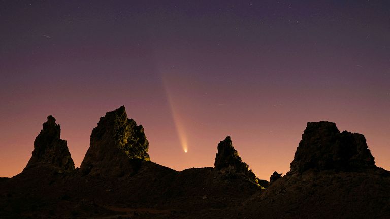 Comet Tsuchinshan-ATLAS, C/2023, with an 80,000 year orbit, passes behind geological formations, tufa spires at Trona Pinnacles, California, U.S. October 12, 2024.....REUTERS/David Swanson     TPX IMAGES OF THE DAY     