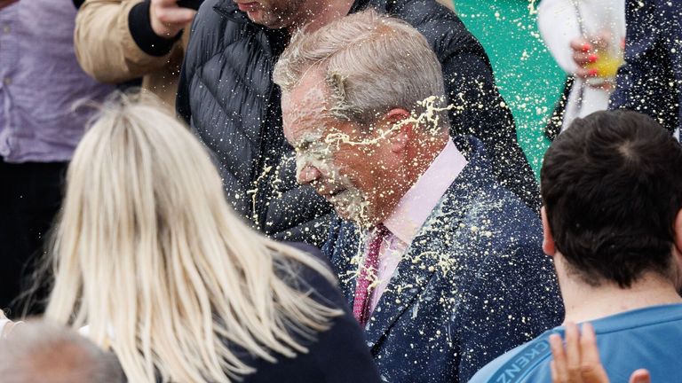 Mandatory Credit: Pic: TOLGA AKMEN/EPA-EFE/Shutterstock 
A young woman (L) throws a milkshake at Nigel Farage (R), leader of Reform UK party and prospective parliamentary candidate for Clacton, in Clacton-on-sea, Essex, Britain, 04 June 2024. 