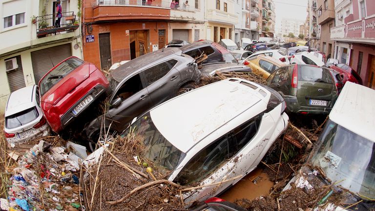 Cars are photographed piled up after being swept away by floods in Valencia, Spain, Wednesday, Oct. 30, 2024. (AP Photo/Alberto Saiz)