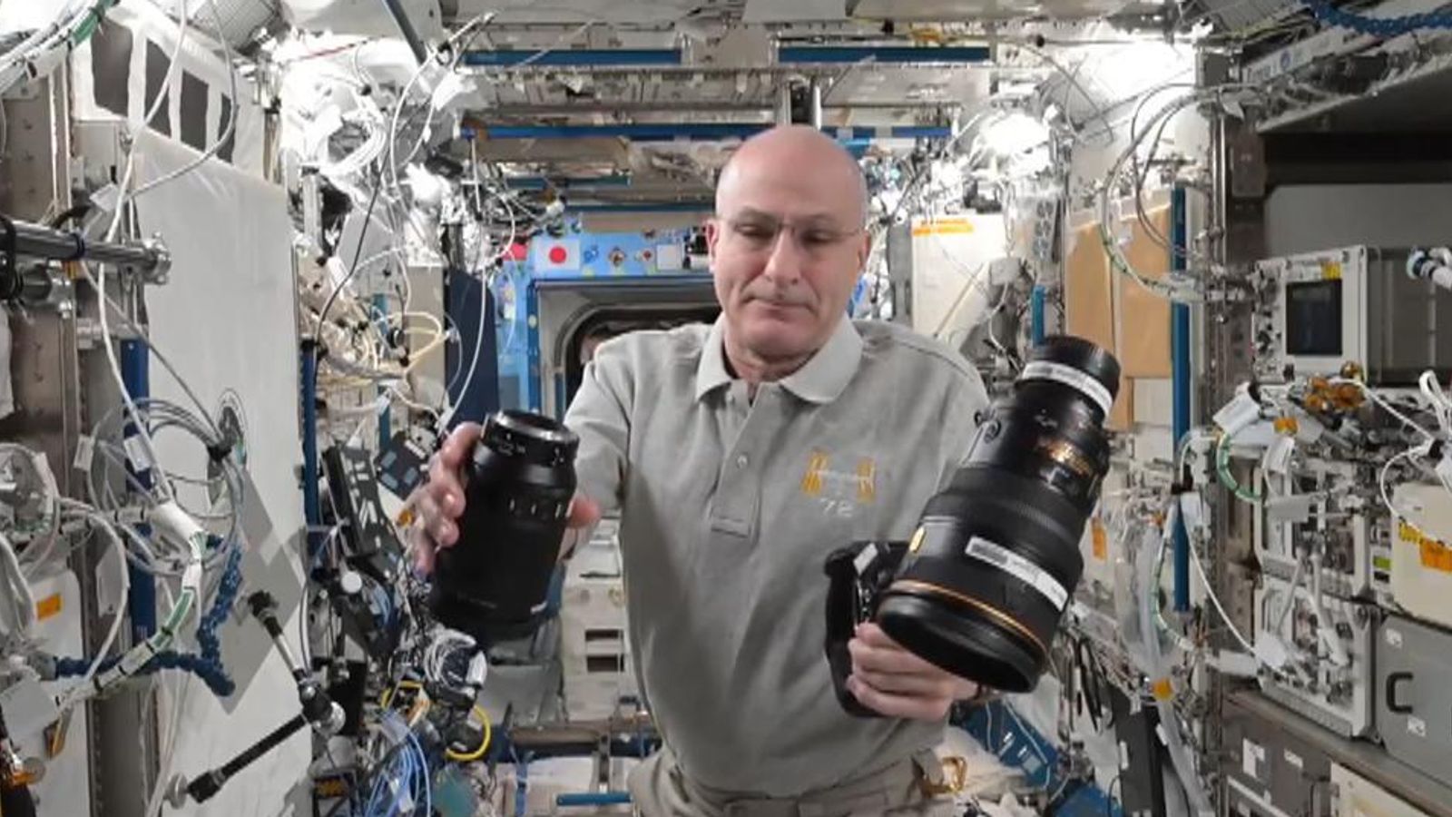 Changing camera lens in zero gravity on the International Space Station ...