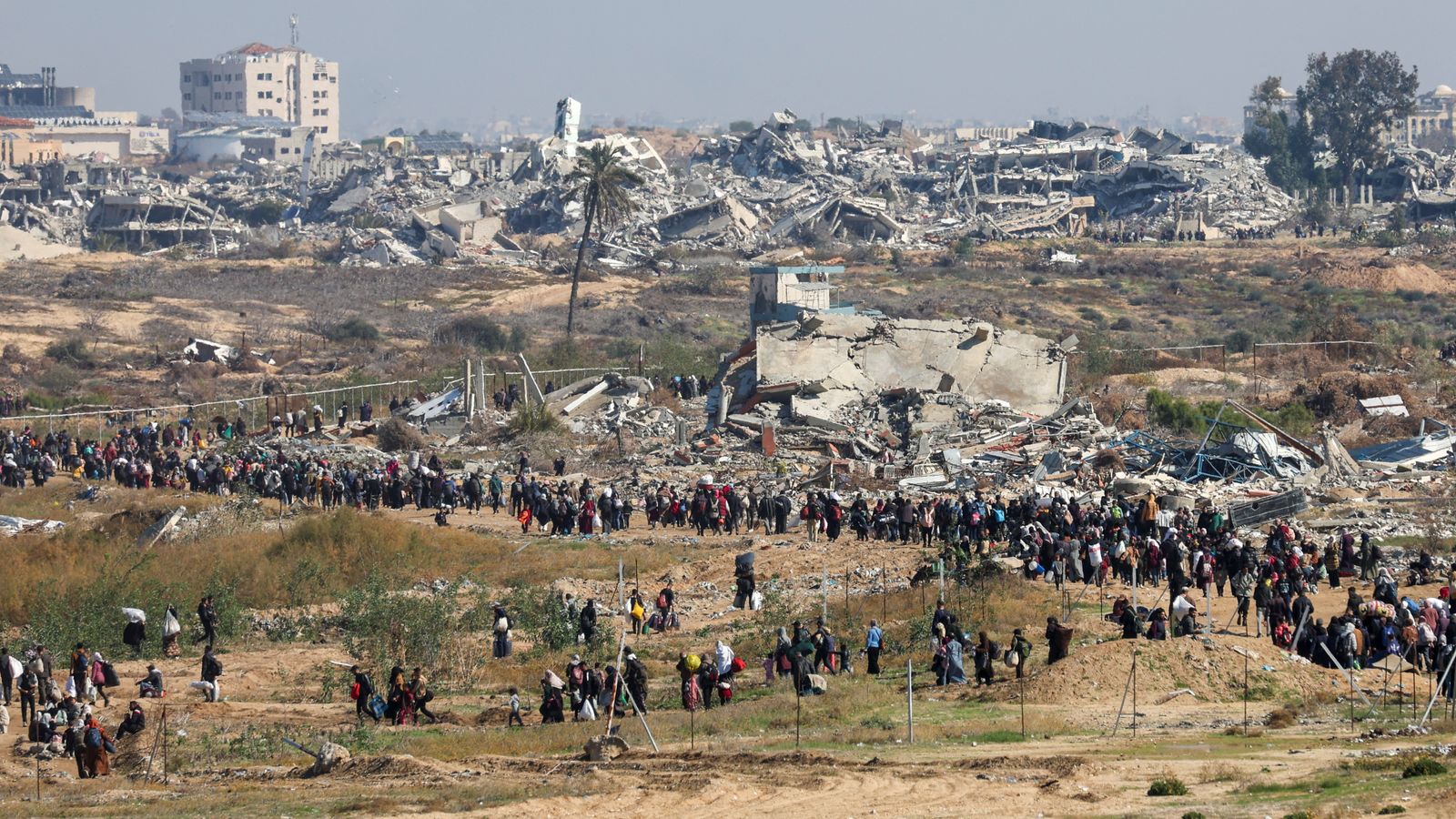 Gaza ceasefire latest: Palestinians walk back to destroyed homes in
