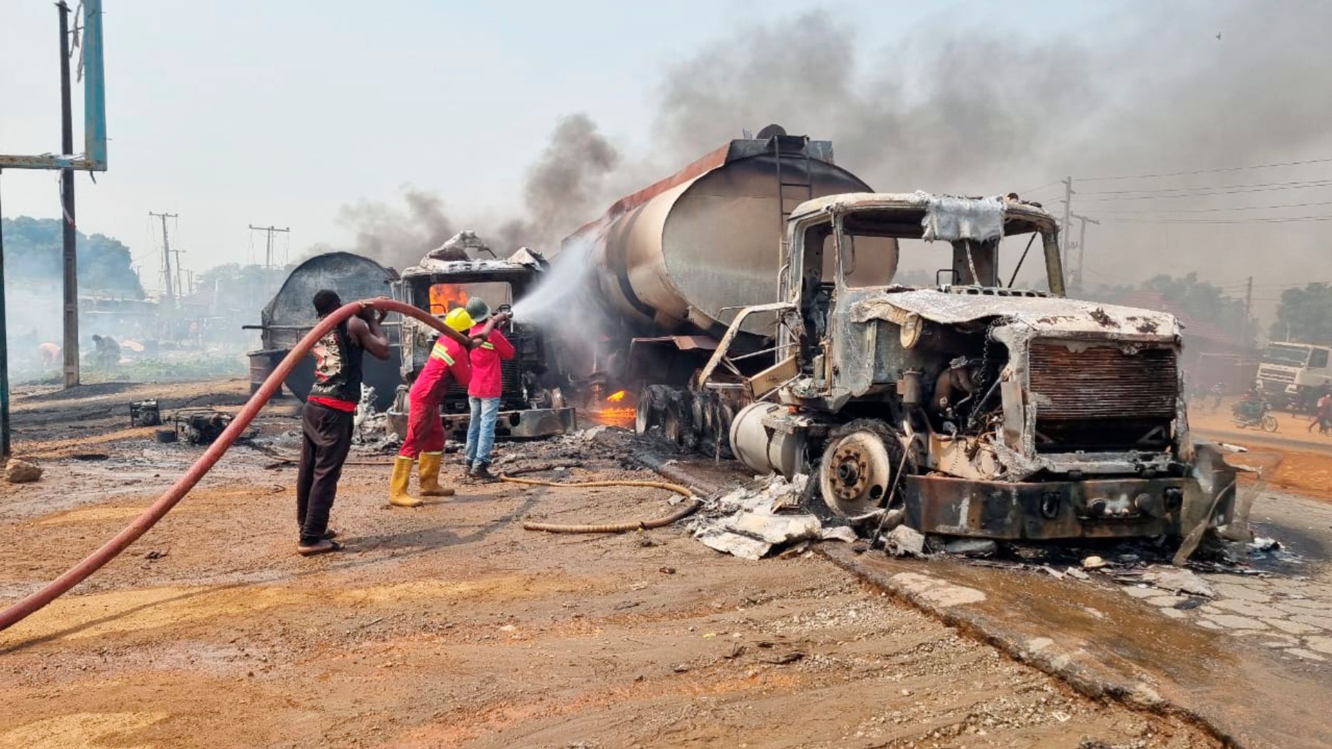 Fuel explosion kills 70 as crowd 'scooped fuel' from overturned tanker