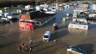 A man is rescued from the flooding at a caravan park near Barrow upon Soar, Leicestershire.
Pic: PA