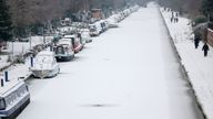 People walk along the towpath of a frozen and snow-covered section of the Bridgewater Canal in Manchester.
Pic: Reuters