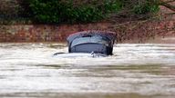 A car is submerged under water near the River Devon, in Bottesford, Leicestershire.
Pic: PA