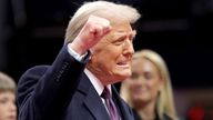 Donald Trump gestures during the inaugural parade inside Capital One Arena on the inauguration day of his second presidential term.
Pic: Reuters