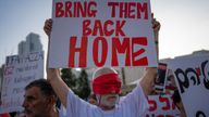 FILE - Residents of Kibbutz Kfar Azza wear blindfolds during a demonstration in solidarity with friends and relatives being held hostage in the Gaza Strip, in Tel Aviv, Israel, on Nov. 2, 2023. (AP Photo/Oded Balilty, File)
