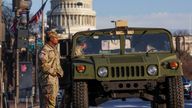 U.S. National Guardsmen patrol on the Pennsylvania Avenue, with the Capitol Hill in the background, ahead of the presidential inauguration of U.S. President-elect Donald Trump, in Washington, U.S., January 18, 2025. REUTERS/Mike Segar