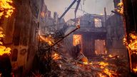 The Palisades Fire burns a residence in the Pacific Palisades neighborhood of Los Angeles, Tuesday, Jan. 7, 2025. (AP Photo/Ethan Swope)


