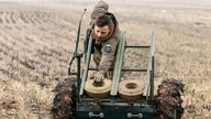 A serviceman of 13th Operative Purpose Brigade 'Khartiia' of the National Guard of Ukraine operates a mine-laying unmanned ground vehicle in Kharkiv region, amid Russia's attack on Ukraine, January 13, 2025. REUTERS/Sofiia Gatilova