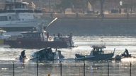 Search and rescue efforts are seen around a wreckage site in the Potomac River from Ronald Reagan Washington National Airport, early Thursday morning, Jan. 30, 2025, in Arlington, Va. (AP Photo/Mark Schiefelbein)