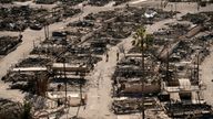 Firefighters walk along a road in a fire-ravaged community in the aftermath of the Palisades Fire in the Pacific Palisades neighborhood of Los Angeles. Pic: AP