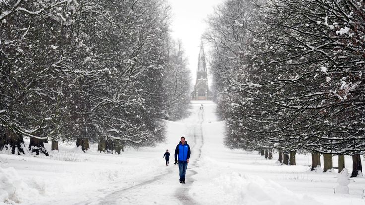 A man walks in the snow in Studley Royal Park in North Yorkshire. Pic: PA