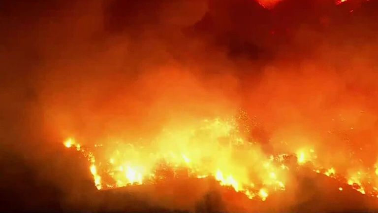 Aerial footage shows wildfires burn through Hollywood Hills