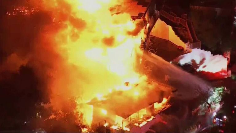 Wildfires burn through Studio City as homes continue to collapse