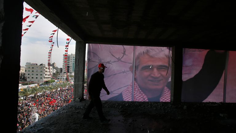 A palestinian walks past a poster depicting Ahmed Saadat, the jailed leader of the Popular Front for the Liberation of Palestine (PFLP), during a rally in 2013. File pic: Reuters