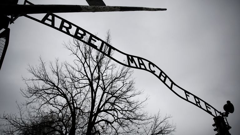 The "Arbeit macht frei" (Work sets you free) gate is pictured on the site of the former Nazi German concentration and extermination camp Auschwitz, empty due to COVID-19 restrictions, two days before the 76th virtual anniversary of the liberation of the camp in Oswiecim, Poland, January 25, 2021. Picture taken January 25, 2021. REUTERS/Kacper Pempel