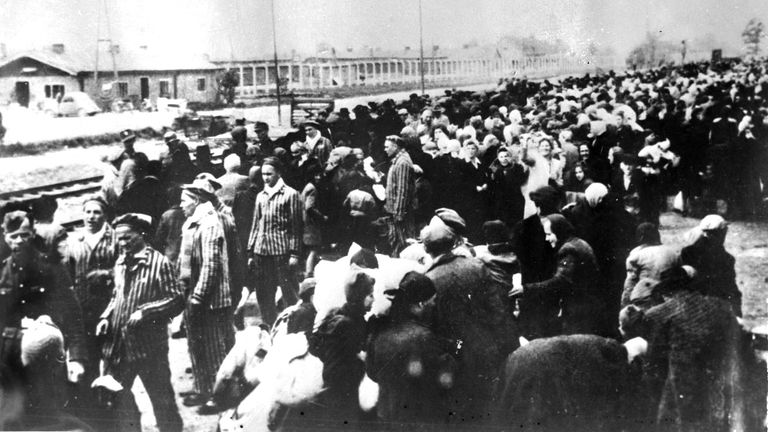 A train-load of victims destined  for Auschwitz concentration camp, lined up on the railway station on arrival at Auschwitz.  A picture taken by the Nazis in the early days of WWII. (AP PHOTO/FILE)