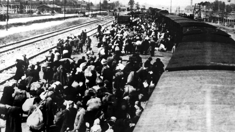 (dpa files) - Prisoners from Hungary arrive at the Auschwitz concentration camp, about 50 km west of Krakow, Poland, spring 1945. In the background are seen the chimneys of the crematory (R and L), in which the bodies of the murdered prisoners were burnt. The Nazi SS had the concentration camp established in 1940 and enlarged to an extermination camp in 1941. It is believed that 2.5 to 4 million people, mostly Jews, were killed here by the Nazi regime until the end of World War II in 1945. Photo by: dpa/picture-alliance/dpa/AP Images