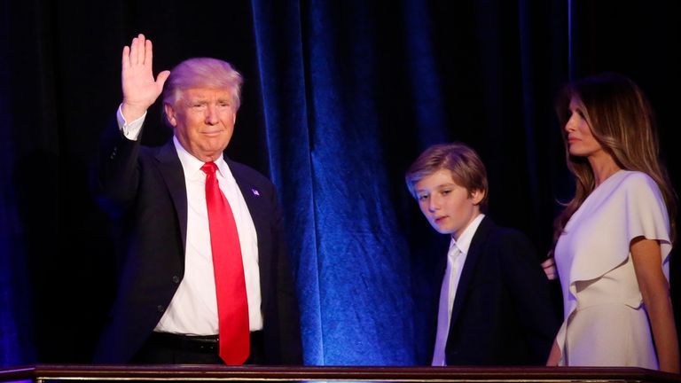 U.S. Republican presidential nominee Donald Trump arrives to speak at his election night rally with his son Barron and wife Melania in Manhattan, New York, U.S., November 9, 2016. REUTERS/Carlo Allegri