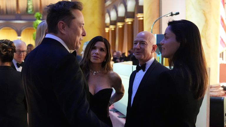 Elon Musk met Jeff Bezos and his partner Lauren Sanchez (second left) at a dinner on Sunday night. Pic: AP