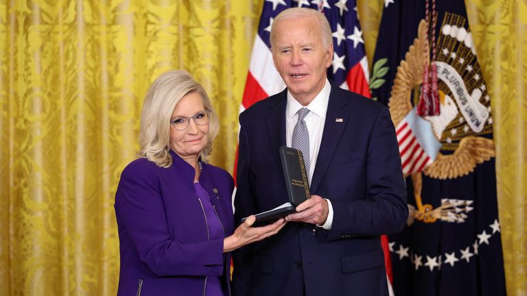 U.S President Joe Biden gives former U.S. Rep. Liz Cheney (R-WY), the Presidential Citizens Medal, one of the country's highest civilian honors, during a ceremony at the White House in Washington, U.S., January 2, 2025. REUTERS/Kevin Lamarque