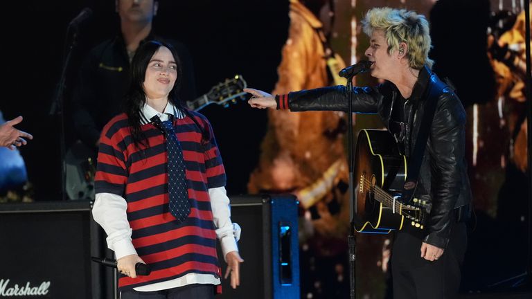 Billie Eilish, left, performs with Billie Joe Armstrong of Green Day during the FireAid benefit concert on Thursday, Jan. 30, 2025, at The Forum in Inglewood, Calif. (AP Photo/Chris Pizzello)