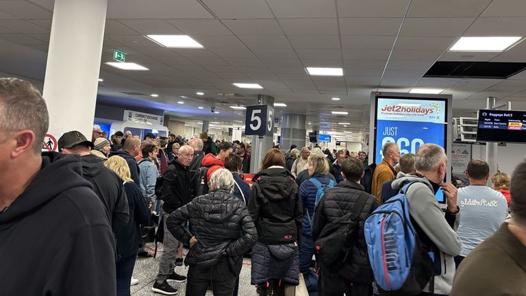 Passengers at the baggage area at Bristol Airport overnight