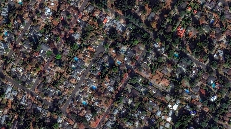 A satellite image shows houses before devastating wildfires, in Altadena, California.
Pic: Maxar/Reuters