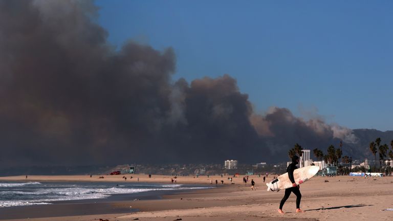 Smoke from a wildfire is seen from the Venice Beach section of Los Angeles, Tuesday, Jan. 7, 2025. (AP Photo/Jae C. Hong)