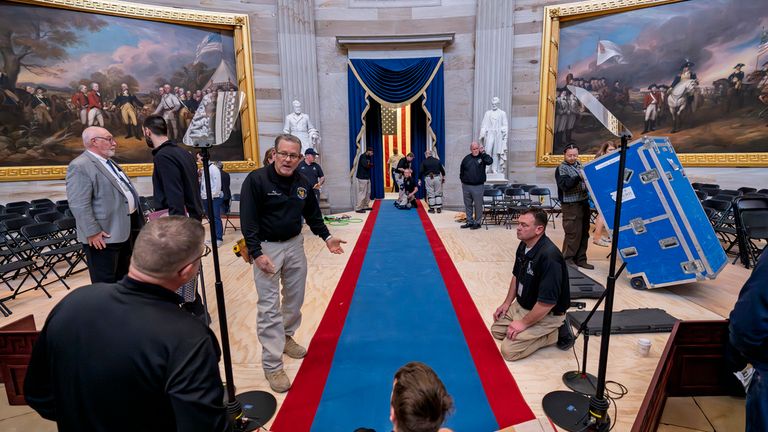 Organisers prepare the Capitol Rotunda for the swearing-in ceremony. Pic: AP