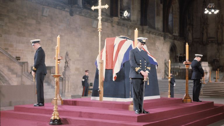 British Naval Officers stand vigil by the coffin of Sir Winston Churchill at Westminster Hall, London, before the funeral. Sir Winston Churchill was buried with full state honors, Jan. 30, 1965. (AP Photo)