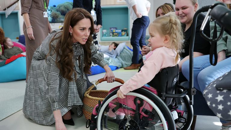 The Princess of Wales, Patron of Ty Hafan Children's Hospice, speaks to three-year-old Dani-Rae.
Pic: PA