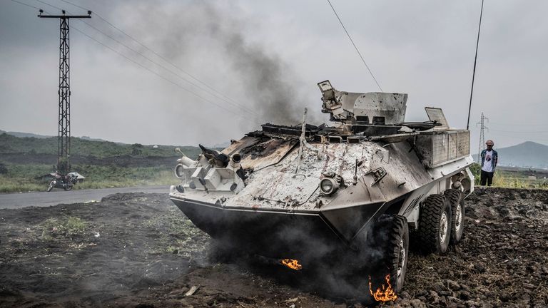 A UN armoured personnel carrier burns during clashes with M23 rebels outside Goma. Pic: AP