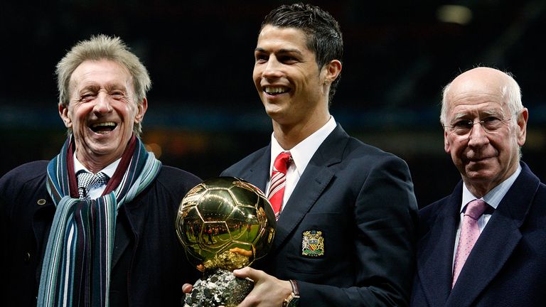 Cristiano Ronaldo, centre, holds the Ballon d'Or trophy in 2008, as former winners Law, left, and Sir Bobby Charlton, right, look on. Pic: AP