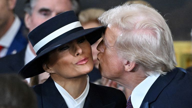 Donald Trump almost kisses Melania Trump as he arrives for the inauguration ceremony before he is sworn in as the 47th US President in the US Capitol Rotunda in Washington, DC, on January 20, 2025. SAUL LOEB/Pool via REUTERS TPX IMAGES OF THE DAY

