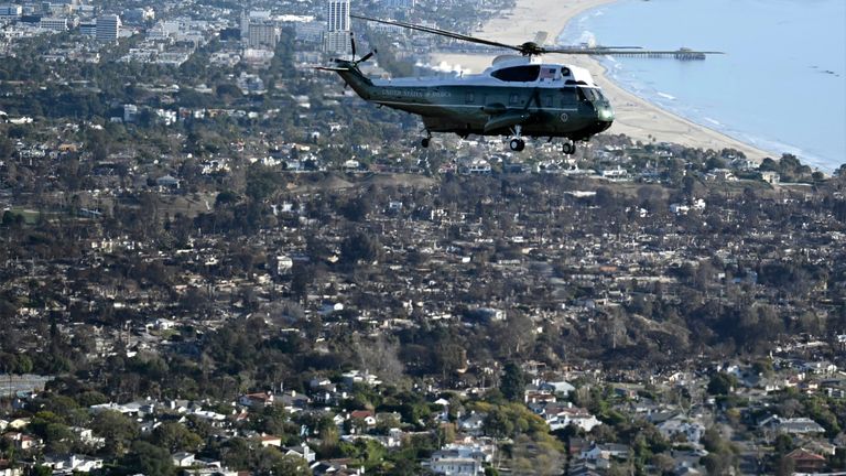 Donald Trump flies over areas devastated by wildfires in Marine One. Pic: AP