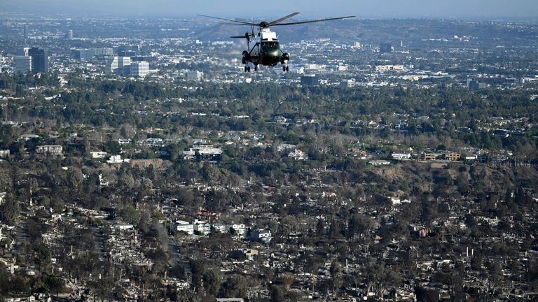 Donald Trump flies over areas devastated by wildfires in Marine One. Pic: AP