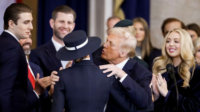 Donald Trump with his wife First Lady Melanie Trump as well as his son Barron Trump , son Eric Trump and daughter Tiffany Trump after being sworn in 