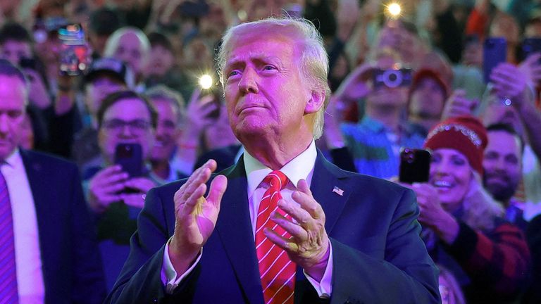 FILE PHOTO: U.S. President-elect Donald Trump arrives to attend a rally the day before he is scheduled to be inaugurated for a second term, in Washington, U.S., January 19, 2025. REUTERS/Carlos Barria/File Photo