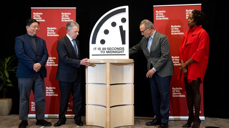 Experts stand with Doomsday Clock after moving it a second closer to midnight. Pic: AP