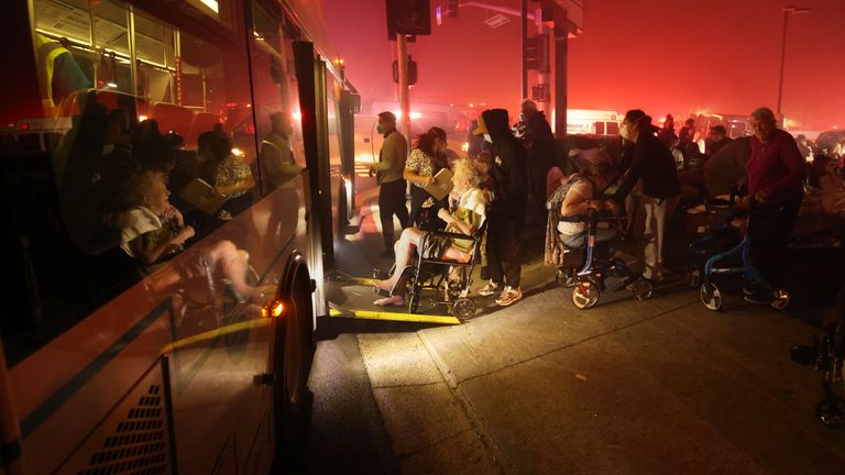 Residents of a senior centre are evacuated as the Eaton Fire approaches.
Pic: AP
